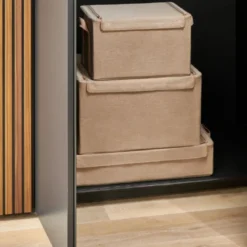 Boîte de rangement en tissu beige avec armature L