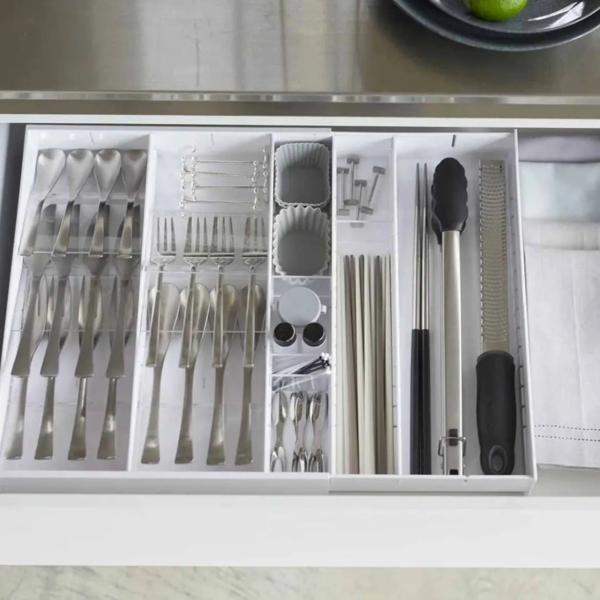 Range-couverts extensible gain de place